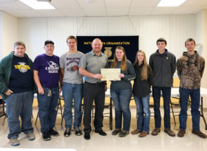 Above: Members of the Christ Our Savior FFA chapter accept the gift from Jacob Fishbein (FCI)