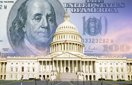 Government building with hundred dollar bill in background